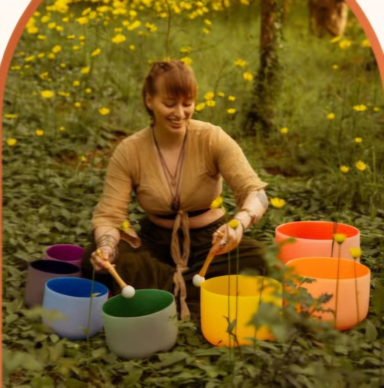 Frankie Kindred playing sound bowls outdoors